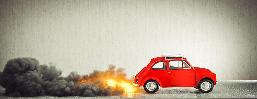 small compact vintage Italian car starts quickly making flames a Photograph by Gualtiero Boffi