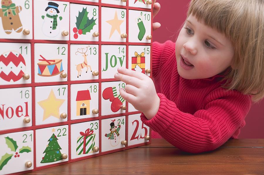 Small girl with Advent calendar Photograph by Image Professionals GmbH