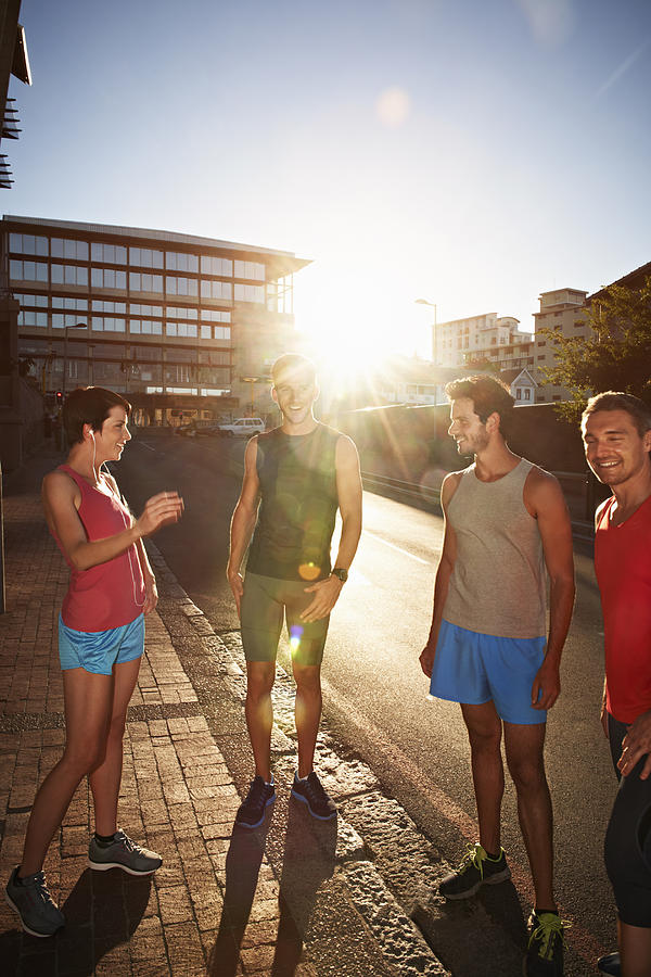 Small group of runners in urban environment Photograph by Uwe Krejci