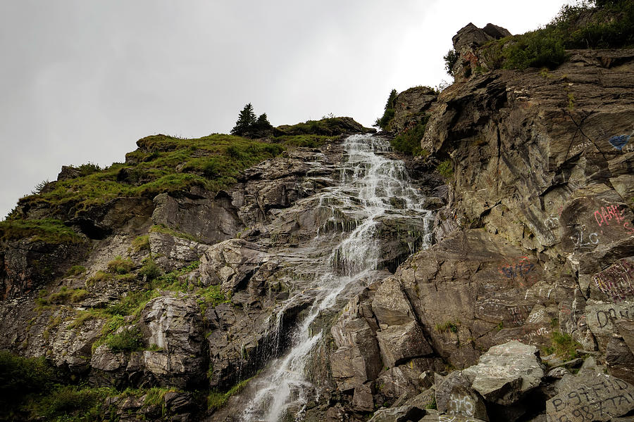 Small waterfall in Romania Carpathians Transfagarasanu pass or r Photograph by Sebastian Radu