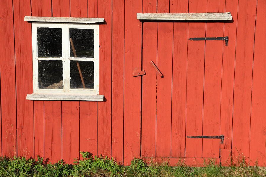 Small window and low door in a red wooden house Photograph by Pejft