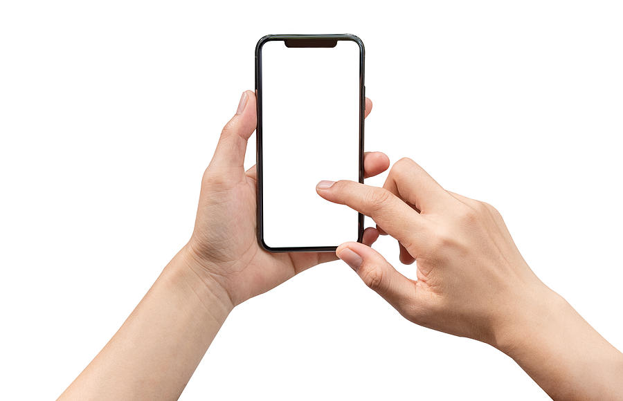 Smartphone in female hands taking photo isolated on white background Photograph by Issarawat Tattong