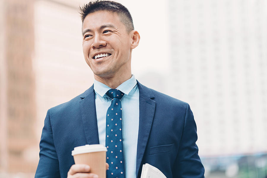 Smiling Asian ethnicity businessman Photograph by Pixelfit