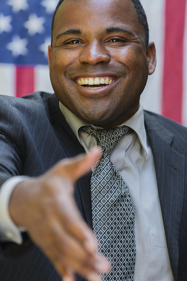 Smiling Black politician offering handshake Photograph by Eric Raptosh Photography