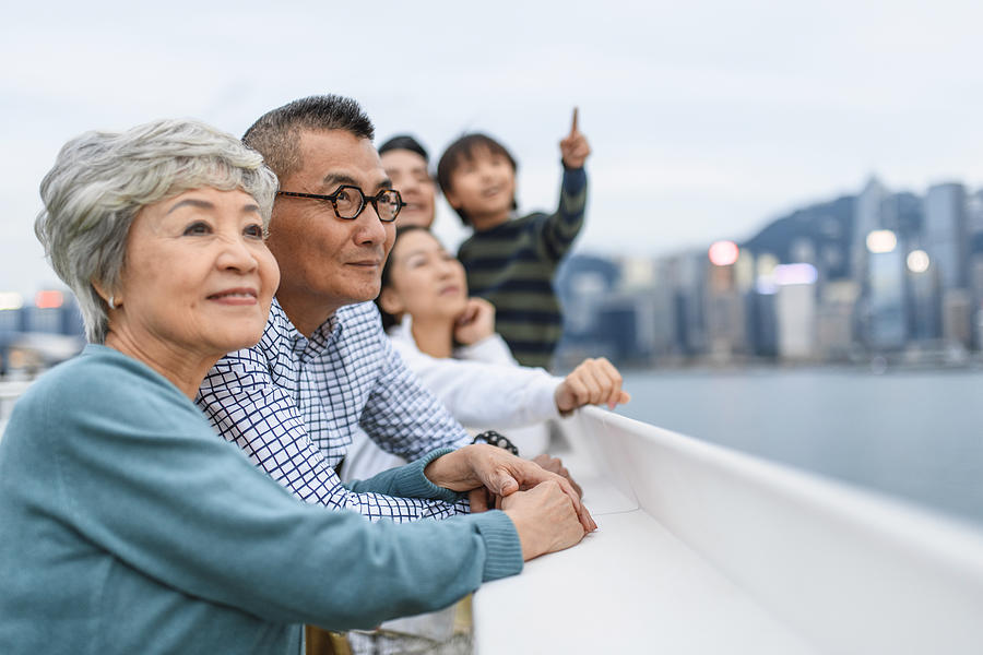 Smiling Chinese Senior Couple Enjoying Hong Kong Views Photograph by AzmanL