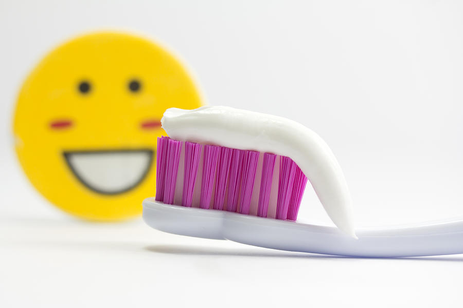 Smiling face and toothbrush with toothpaste Photograph by Fernando Trabanco Fotografía