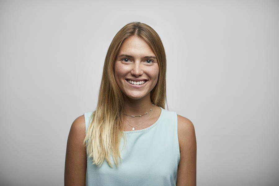 Smiling Female Entrepreneur On White Background Photograph by Morsa Images