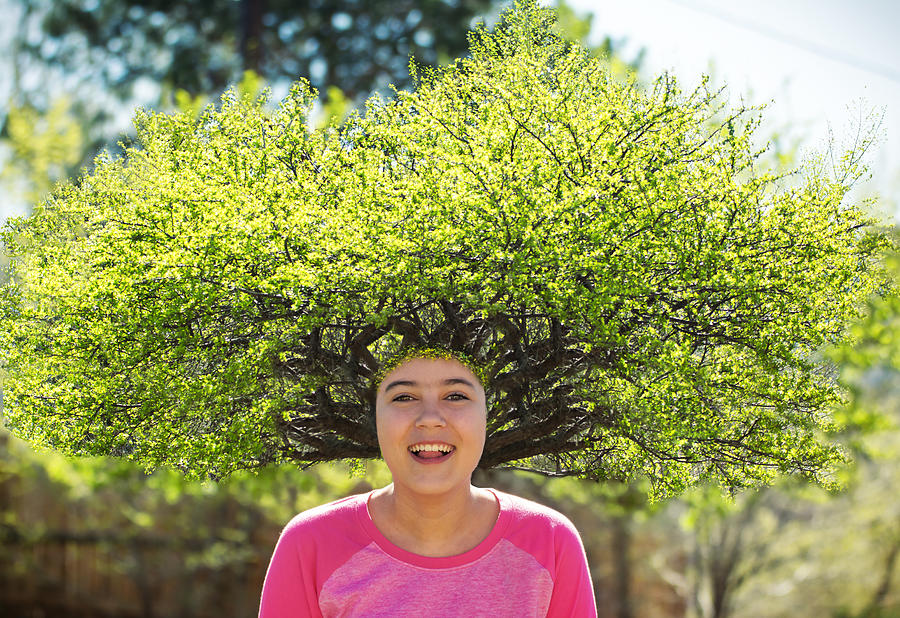 Smiling girl with a tree for hair. Photograph by Harpazo_hope