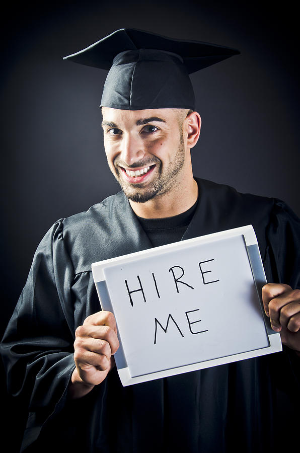 Smiling Graduate With Hire Me Sign Photograph by Mehmed Zelkovic