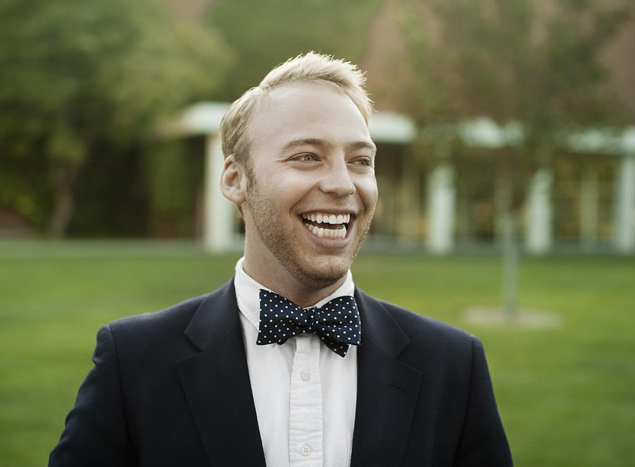 Smiling man in suit and bow tie Photograph by Hill Street Studios