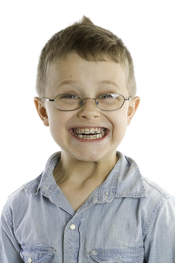 Smiling Smiling Boy With Braces Isolated On White Photograph by Adam Smigielski