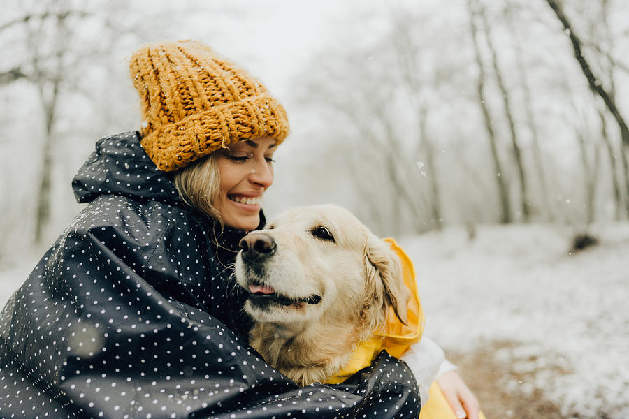 Smiling woman and her dog in a snowy day Photograph by AleksandarNakic