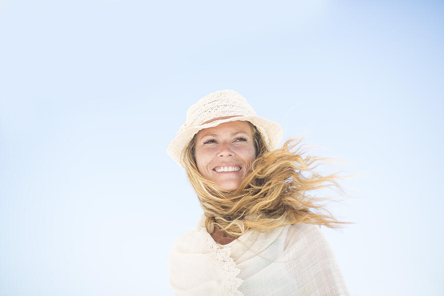 Smiling woman under blue sky Photograph by Westend61
