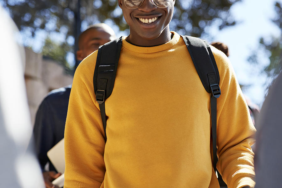 Smiling young male student wearing yellow t-shirt Photograph by Klaus Vedfelt