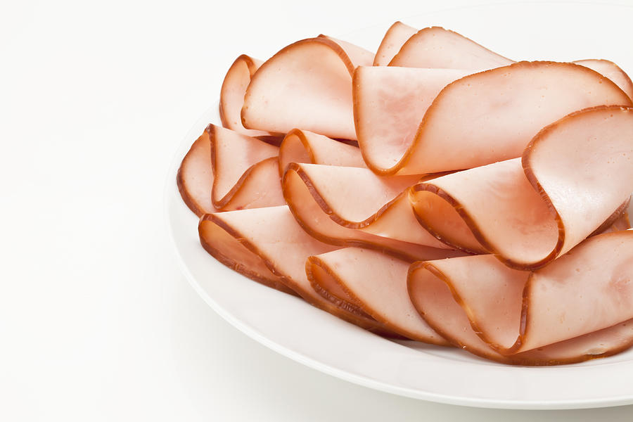 Smoked ham slices on a plate Photograph by Fcafotodigital