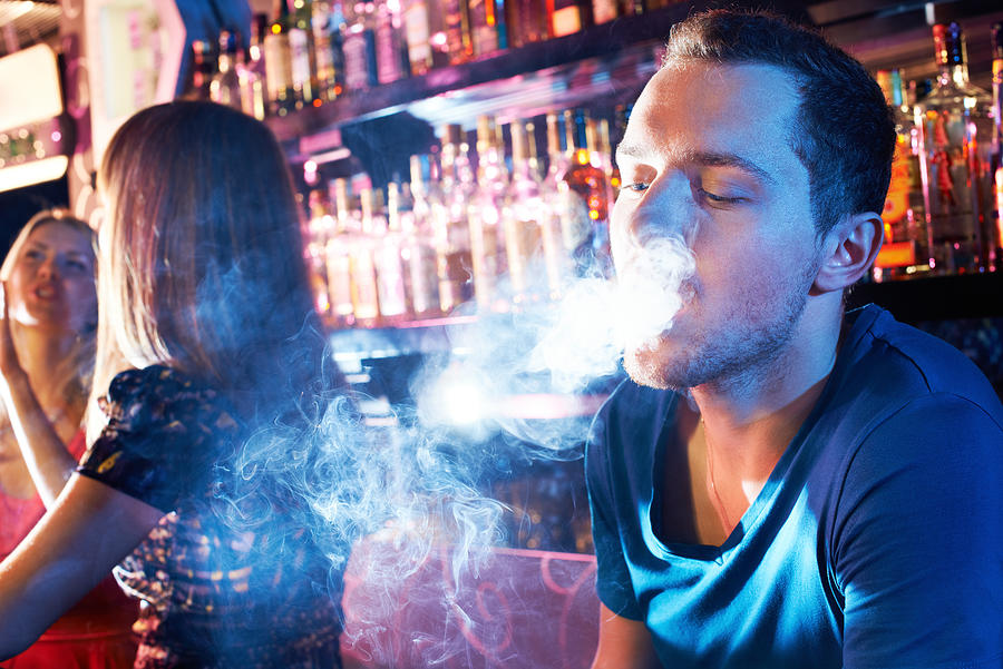 Smoking hookah Photograph by Shironosov