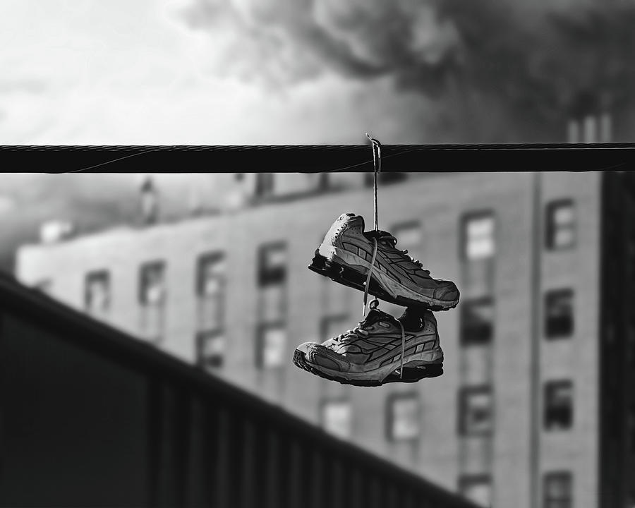 Sneakers On A Wire Photograph