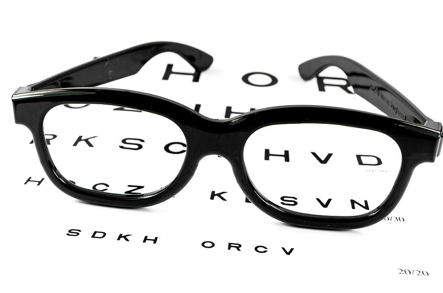 Snelling Eye Chart with Glasses resting upon it Photograph by Wwing