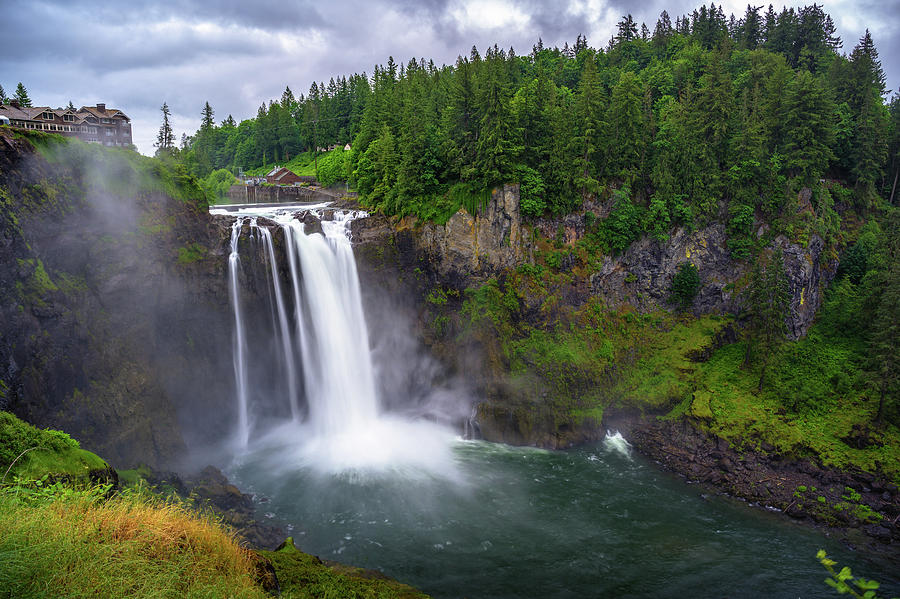 Snoqualmie Falls with lush greenery and mist in Washington State, USA ...