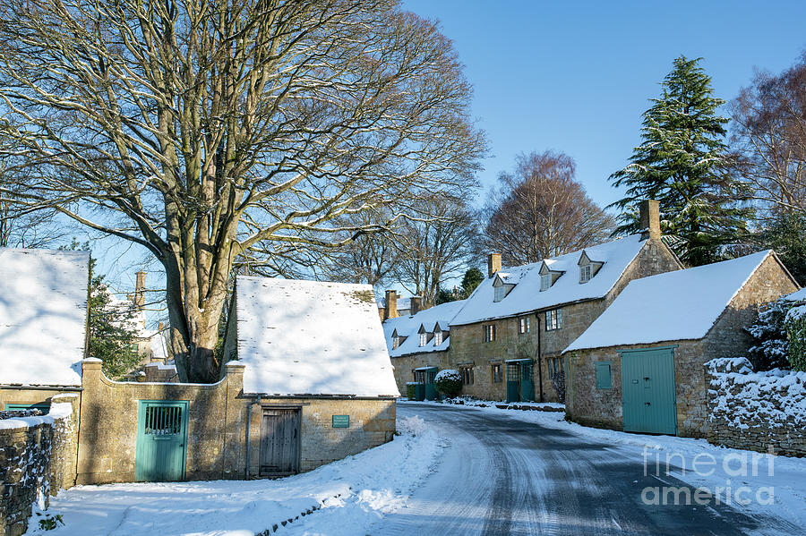Snow and Winter Sunlight Across Snowshill Village Photograph by Tim Gainey