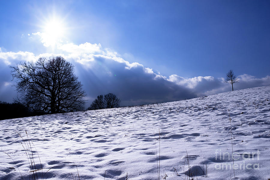 Snow clouds on a sunny winter's day. Photograph by Christine Krigovsky