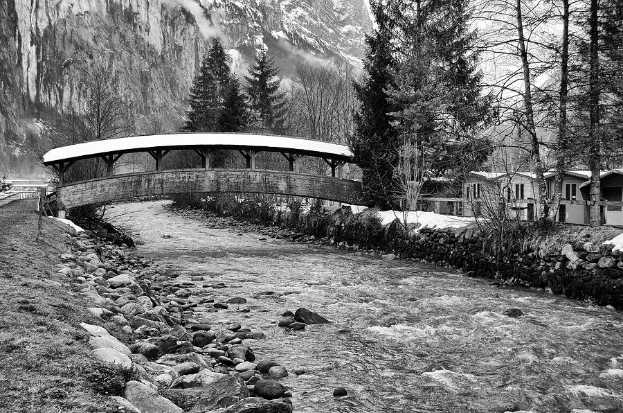 Snow Covered Foot Bridge in Jungfrau Village of Lauterbrunnen Switzerland Black and White Photograph by Shawn OBrien