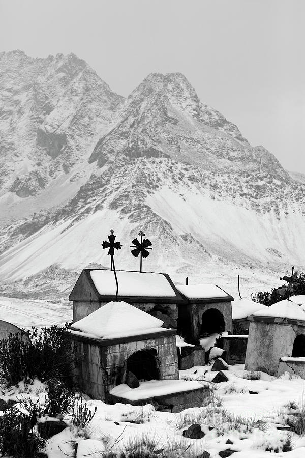 Snow covered graves at Milluni cemetery Bolivia Photograph by James Brunker