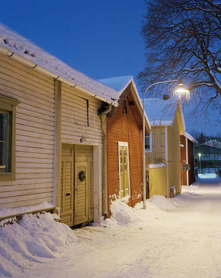 Snow covered houses Sweden. Photograph by Per Eriksson