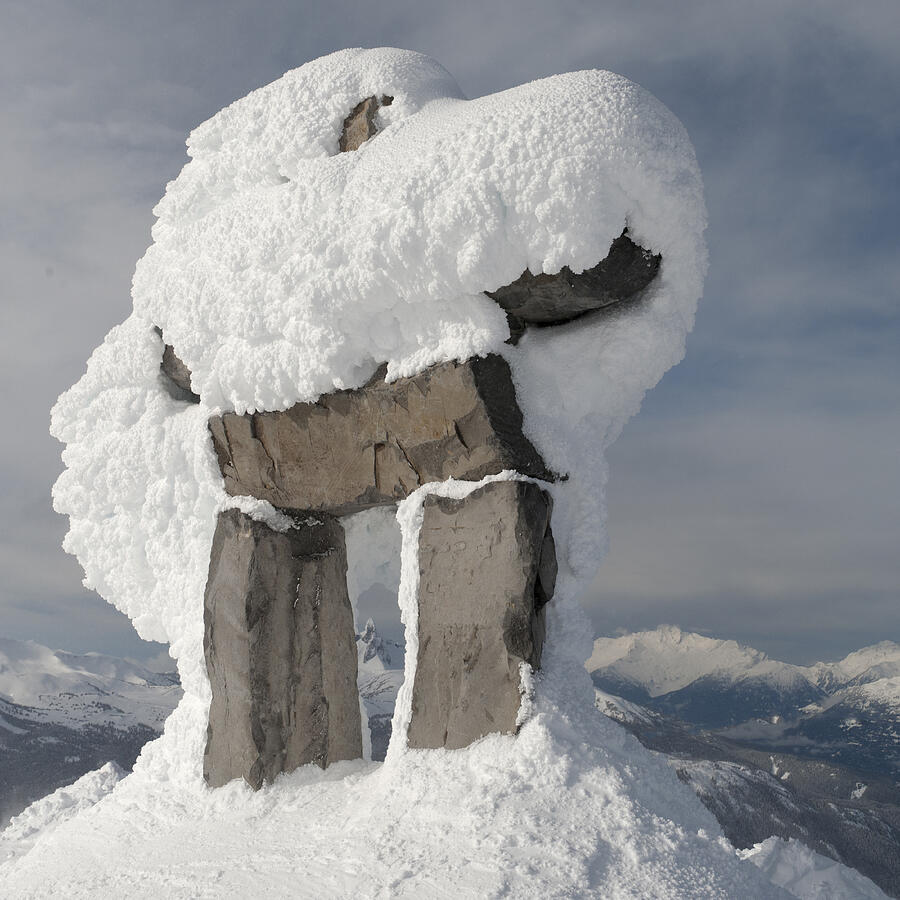 Snow covered inuksuk Photograph by Fotosearch