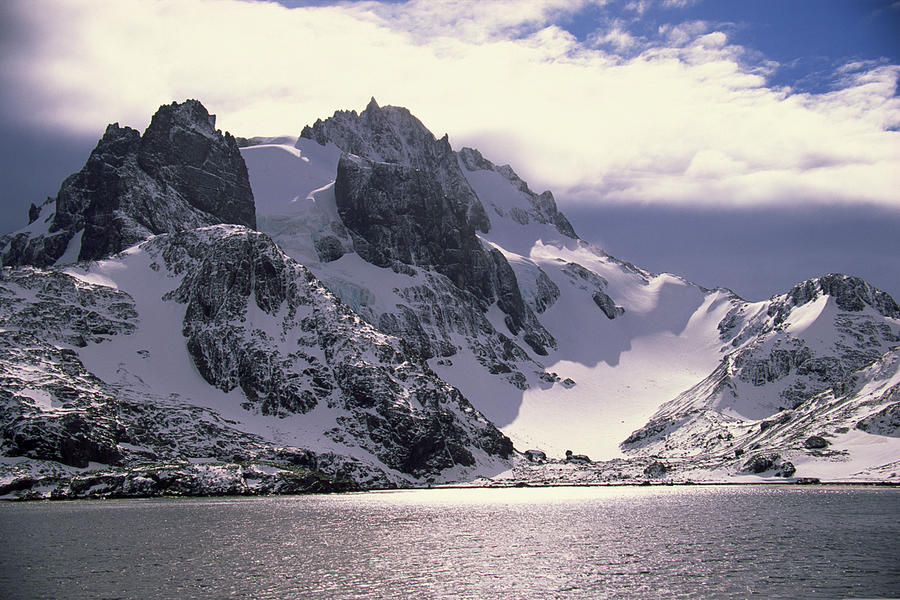 Snow covered mountain peaks in Antarctica Photograph by Comstock Images