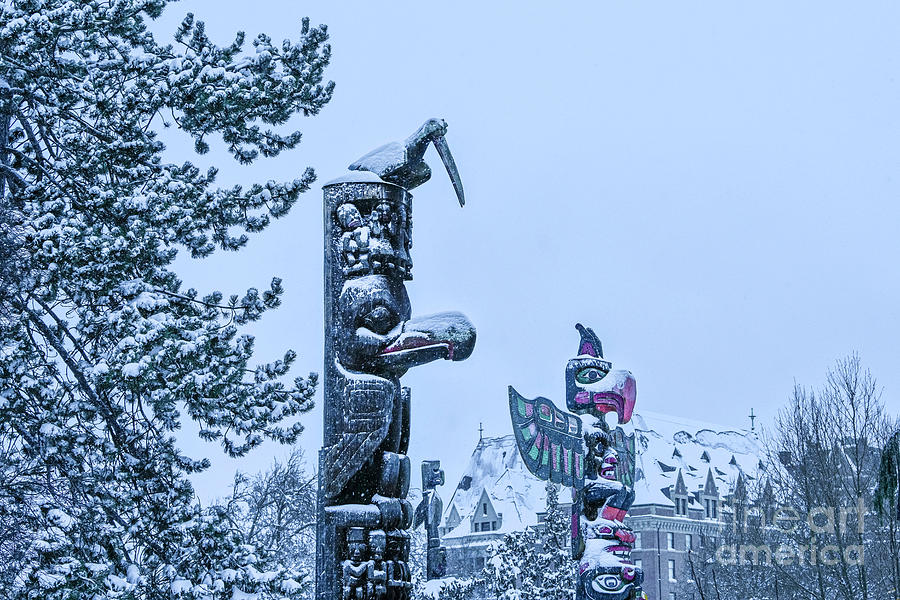 Snow on totem poles Photograph by Michael Wheatley