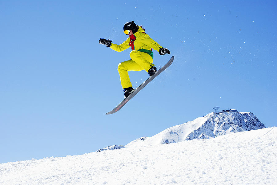 Snowboard jump Photograph by Bogdan Angheloiu