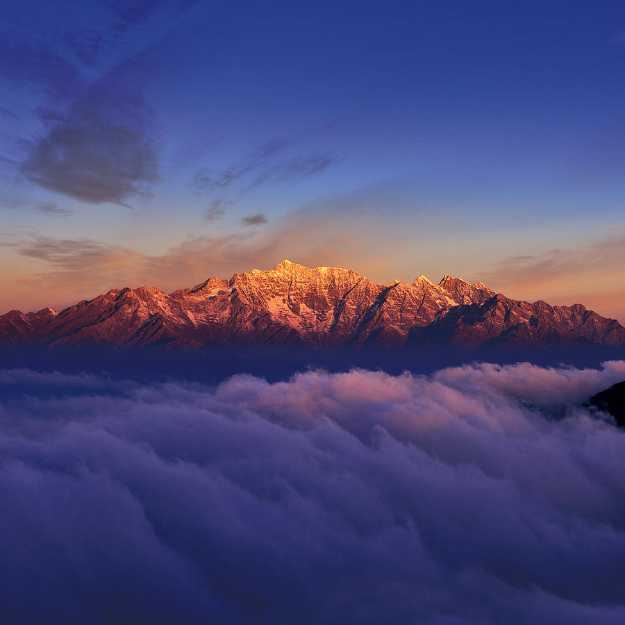 Snowcapped Mountain at Sunrise Photograph by Zorazhuang