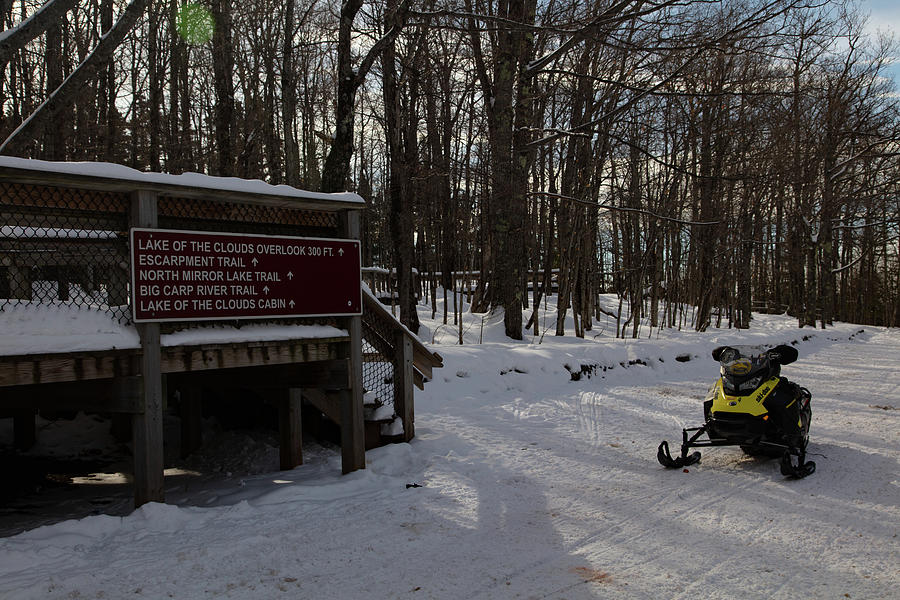 Snowmobile at entrance to Lake of the Clouds in Michigan. Photograph by Eldon McGraw