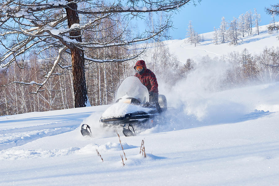 Snowmobile driver having fun Photograph by CliqueImages