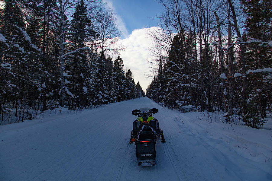 Snowmobile on trail of Lake of the Clouds in Michigan winter Photograph by Eldon McGraw