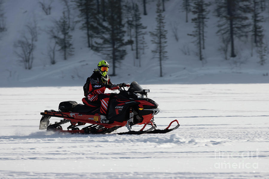 Snowmobiling on Frozen Lake Photograph by Eva Lechner