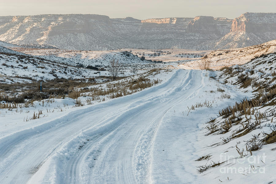 Snowy Road Below Red Sandstone Cliffs Photograph by John Arnaldi