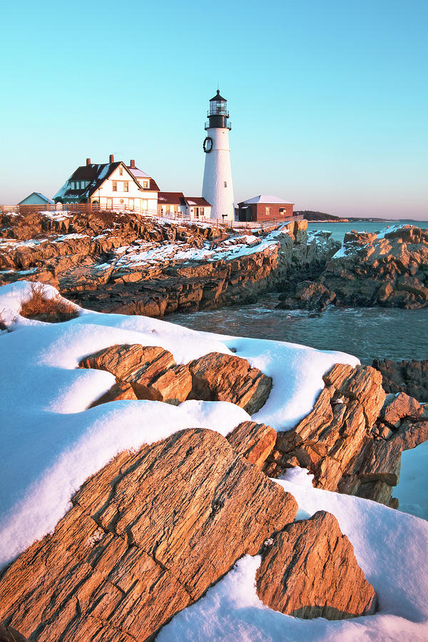Snowy Sunrise at Portland Head Lighthouse Photograph by Eric Gendron