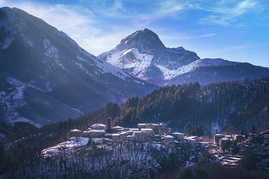 Snowy village in Alpi Apuane Photograph by Stefano Orazzini