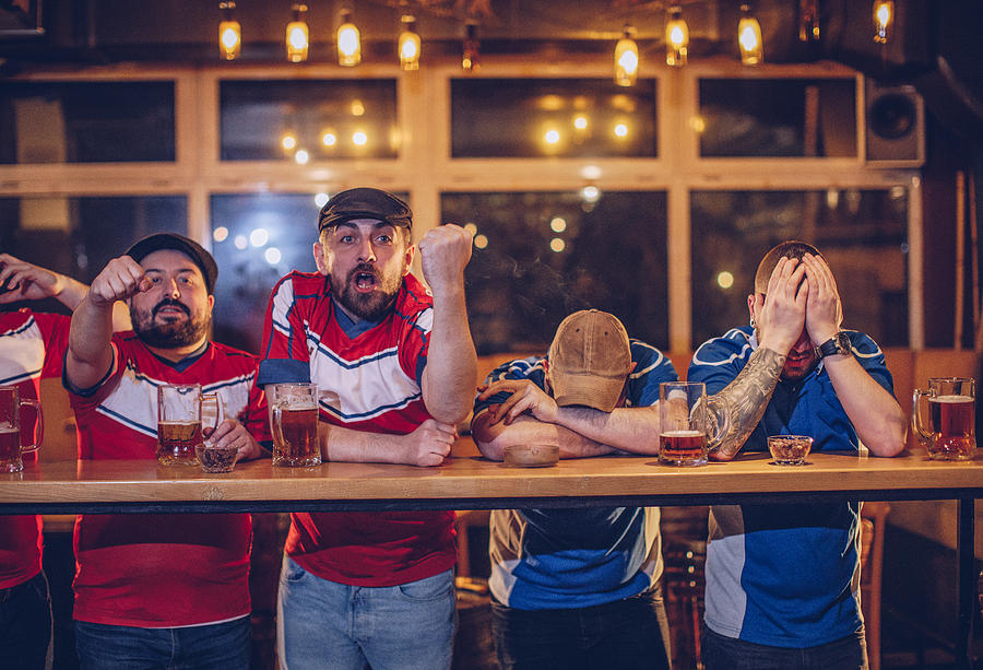 Soccer fans in pub Photograph by South_agency