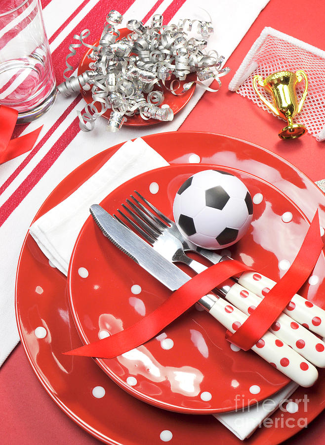 Soccer football celebration party table settings in red and whit Photograph by Milleflore Images