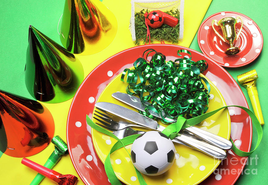 Soccer football celebration party table settings in red, green a Photograph by Milleflore Images