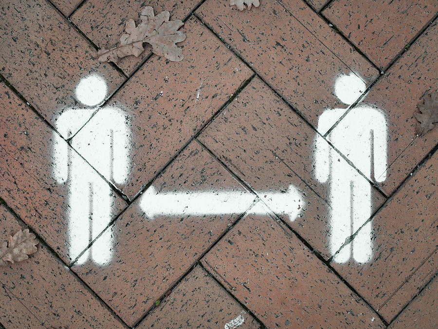 Social distancing spray painted symbol on side walk Photograph by Alex Schwab