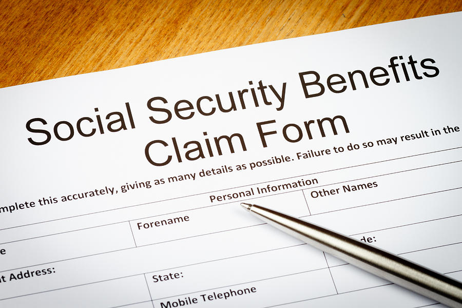 Social Security Benefits claim form Photograph by Nigelcarse