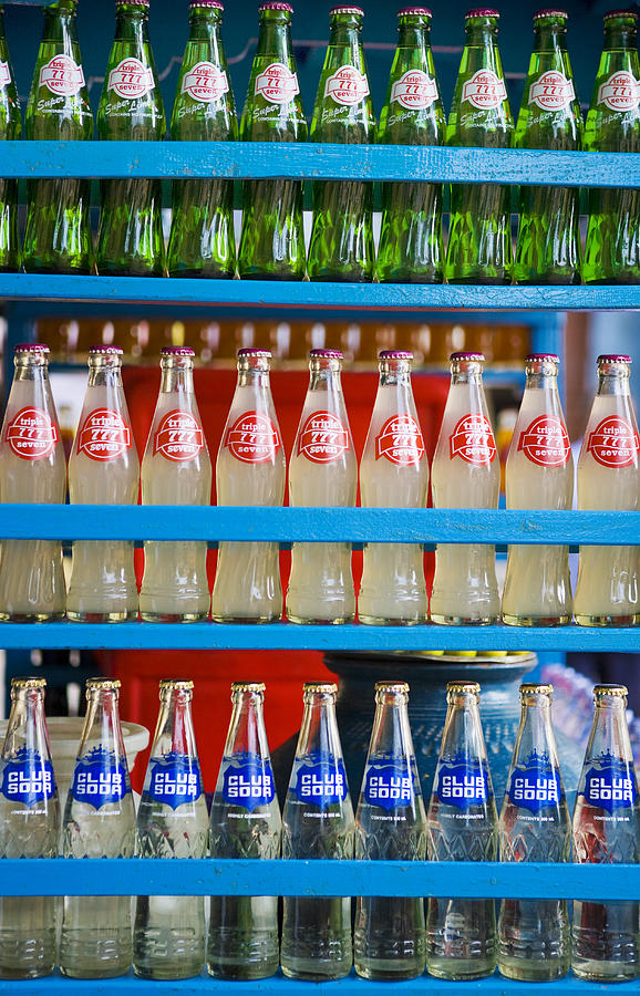 Soda bottles in rack, full frame Photograph by Frank Rothe