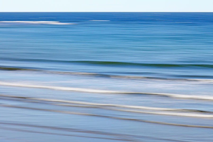 Soft waves on ocean beach (blurred) Photograph by Rainer Grosskopf