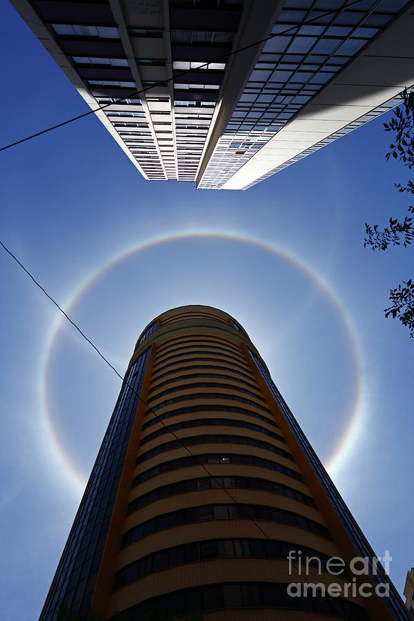 Solar halos and high rise buildings La Paz Bolivia Photograph by James Brunker