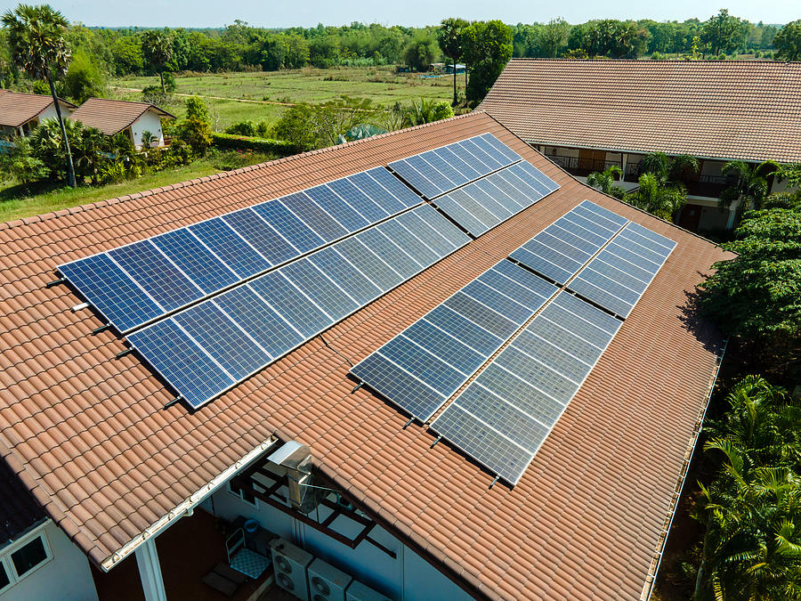 Solar Roof, Solar panels on the roof in country house. Photograph by Pramote Polyamate