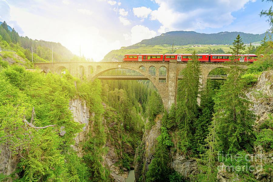 Solis Viaduct of Swiss railway with red train Photograph by Benny Marty